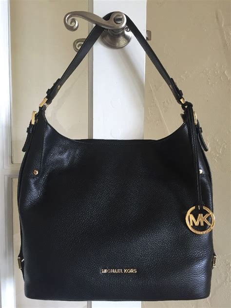 michael kors black purse year 2014 gold hardware|Michael Kors large gold tote.